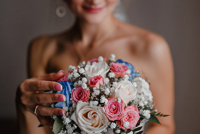 Woman Holding Wedding Bouquet