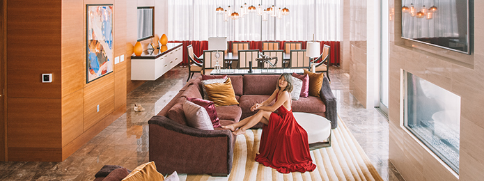 Woman in hotel room on couch